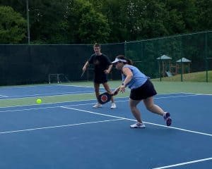 Playing pickleball on tennis court