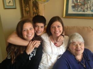 Sandwich generation photo of Elizabeth with her kids and her mom